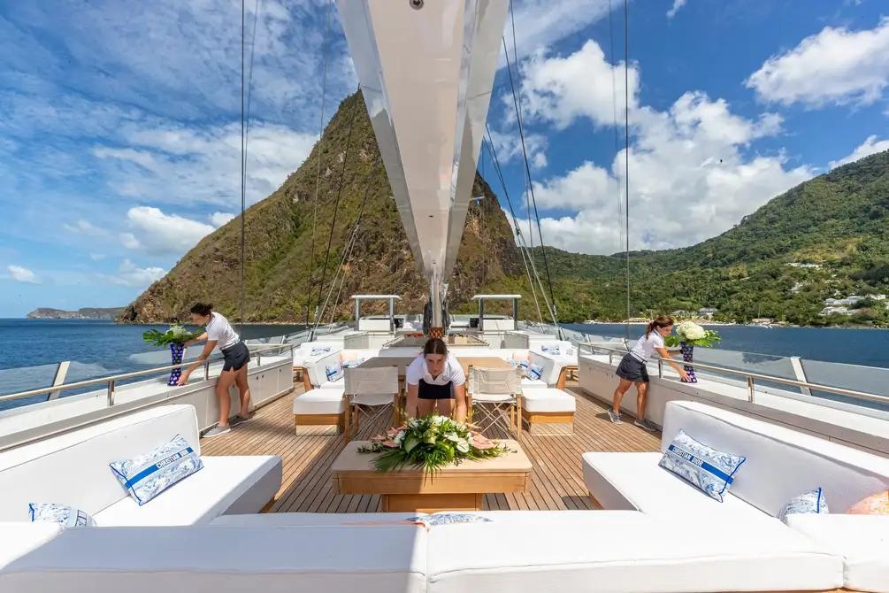 Yacht crew preparing the deck before guests arrive