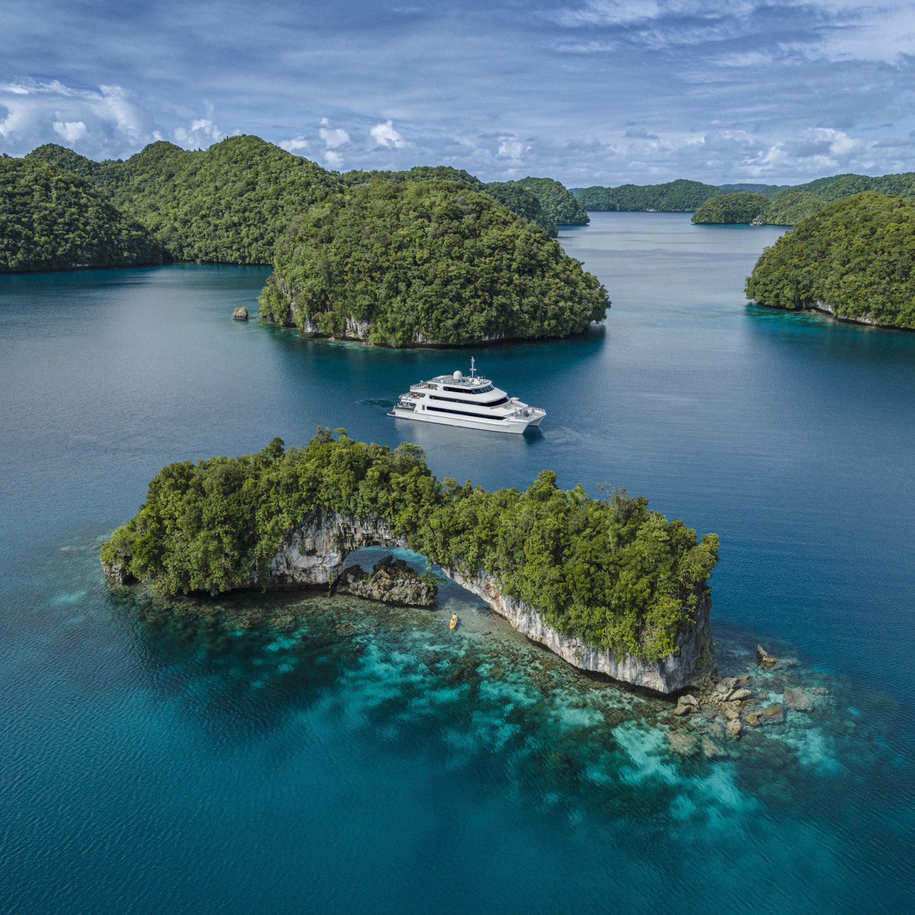 Yacht anchored near a secluded beach